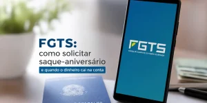 Smartphone com texto do FGTS e Carteira de Trabalho no escritório